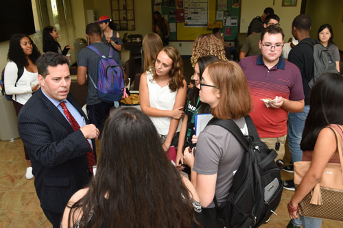 Saint Leo President Jeffrey Senese talks with students at Cookies and Conversation
